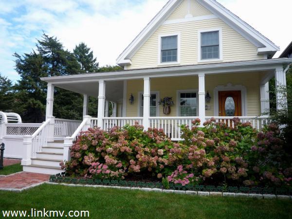 front of house with colorful landscaping