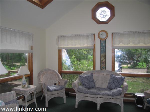 Sunroom with cathedral ceiling