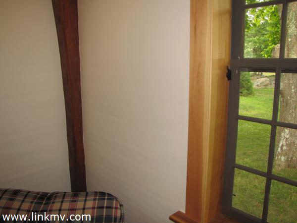 Note seeded windows, original beams, and lath and plaster walls