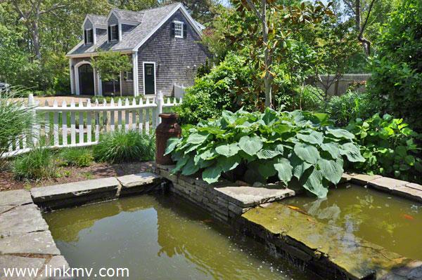Woven Into The Outdoor Space Is A Koi Pond
