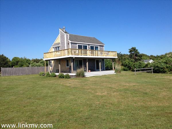 Front with new shingles and railing