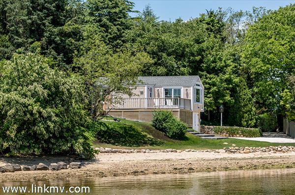 Cottage Sits On The Shoreline Of The Lagoon