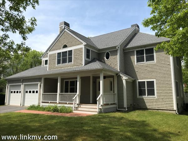 Exterior with deck overlooking back yard.