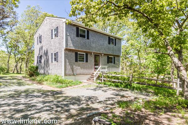 Set back on the lot for privacy with a large back yard that abuts the State Forest.