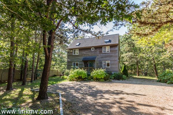 Classic saltbox in a pleasant neighborhood tucked on a private lot.