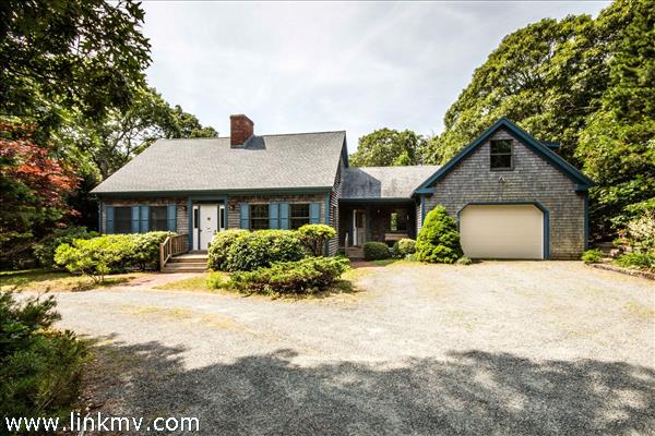 Classic cape style with finished breezeway and guest suite above garage.